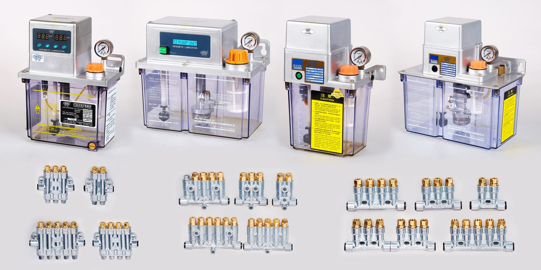 The Herg range: motor-driven lubrication pumps above, volumetric and progressive distributors below
