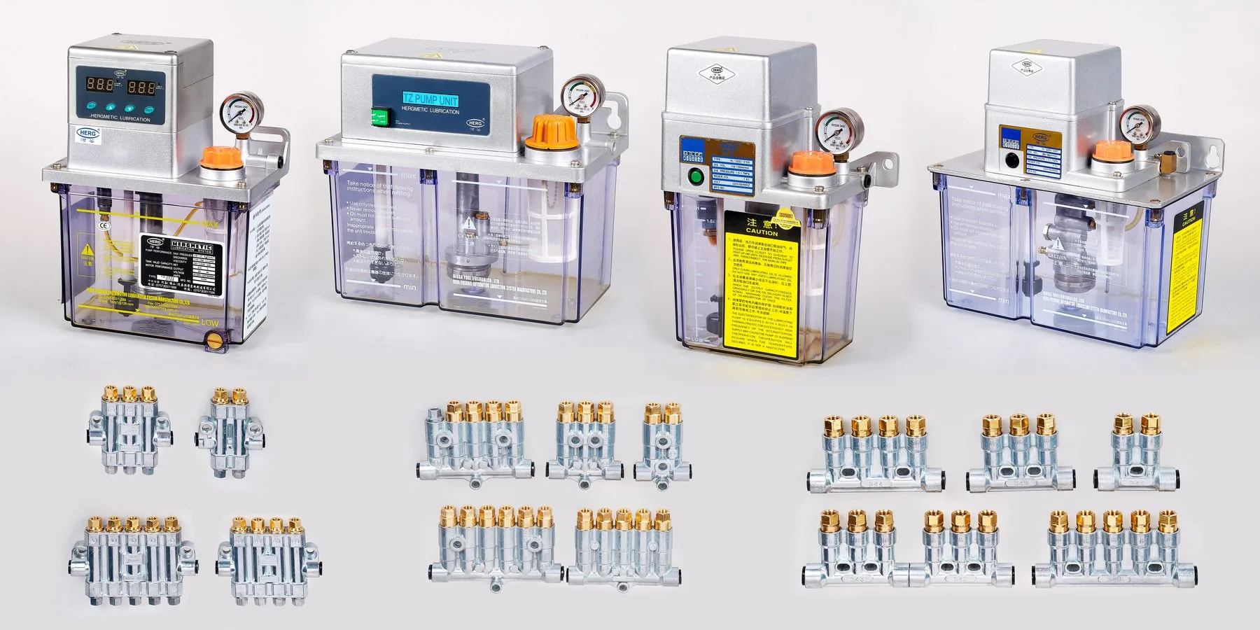 The Herg range: motor-driven lubrication pumps above, volumetric and progressive distributors below